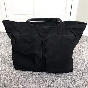 Black nylon Lululemon gym bag w/ laptop sleeve - perfect for work and travel!